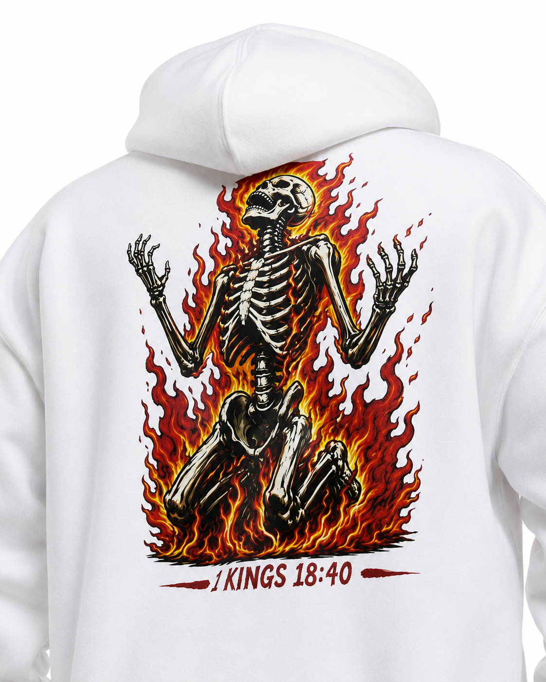 White pullover hoodie shown from the back, featuring a large graphic print of a kneeling skeleton surrounded by red and orange flames, with the text '1 KINGS 18:40' printed below in red.