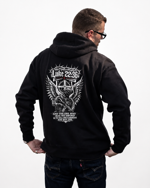 A man wearing a black hoodie with a large white graphic print of soldier on the back, shown from behind against a plain white background.